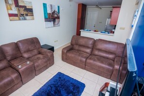 Room | Living area | 46-inch flat-screen TV with cable channels, TV - Palms PARADISE (Kingston)
