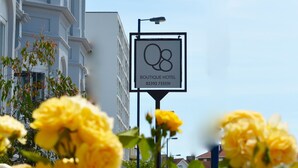 A hotel sign with the number 08 and the name 'Boutique Hotel' along with a phone number. - Q8 Boutique Hotel (Portsmouth)