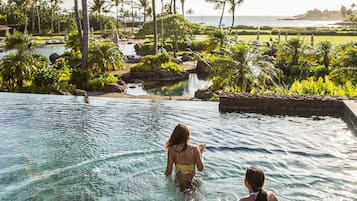 5 outdoor pools, open 7 AM to 8 PM, pool umbrellas, pool loungers