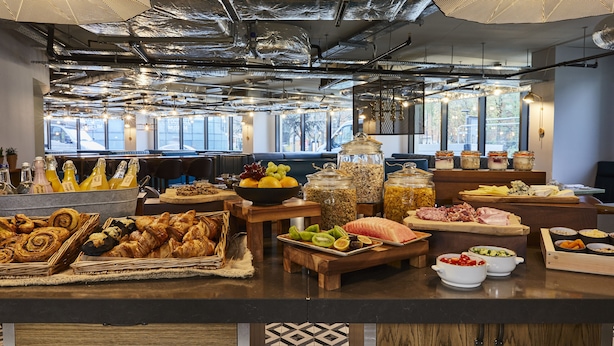 A buffet with various food items and beverages. - Hotel Indigo Manchester - Victoria Station by IHG (Manchester)
