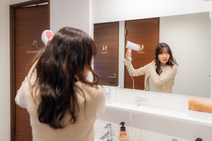 Hair dryer, electronic bidet, towels
