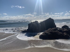 A beach with large rocks and waves. - Beautiful Beachfront “Oasis by the Sea” in the Heart of Oak Bluffs!   (Oak Bluffs)