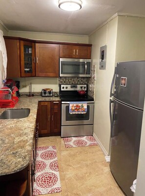 Family Apartment, Multiple Beds, Non Smoking | Private kitchen | Fridge, stovetop, coffee/tea maker, toaster