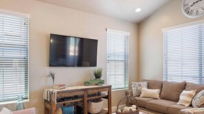 Flat-screen TV, DVD player, books