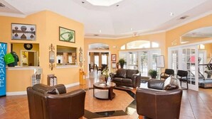 A spacious lobby with leather seating, a massage service counter, and a treadmill area. - Stay in a Star Wars-themed vacation home in Emerald Island Resort near Disney. This family-friendly Kissimmee getaway features a private pool and spa, game room, smart-lock check-in, and room for your group to relax after the parks. (Kissimmee)