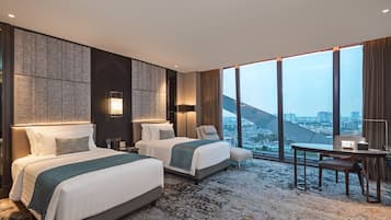 Junior Suite Twin Room | Minibar, in-room safe, desk, laptop workspace