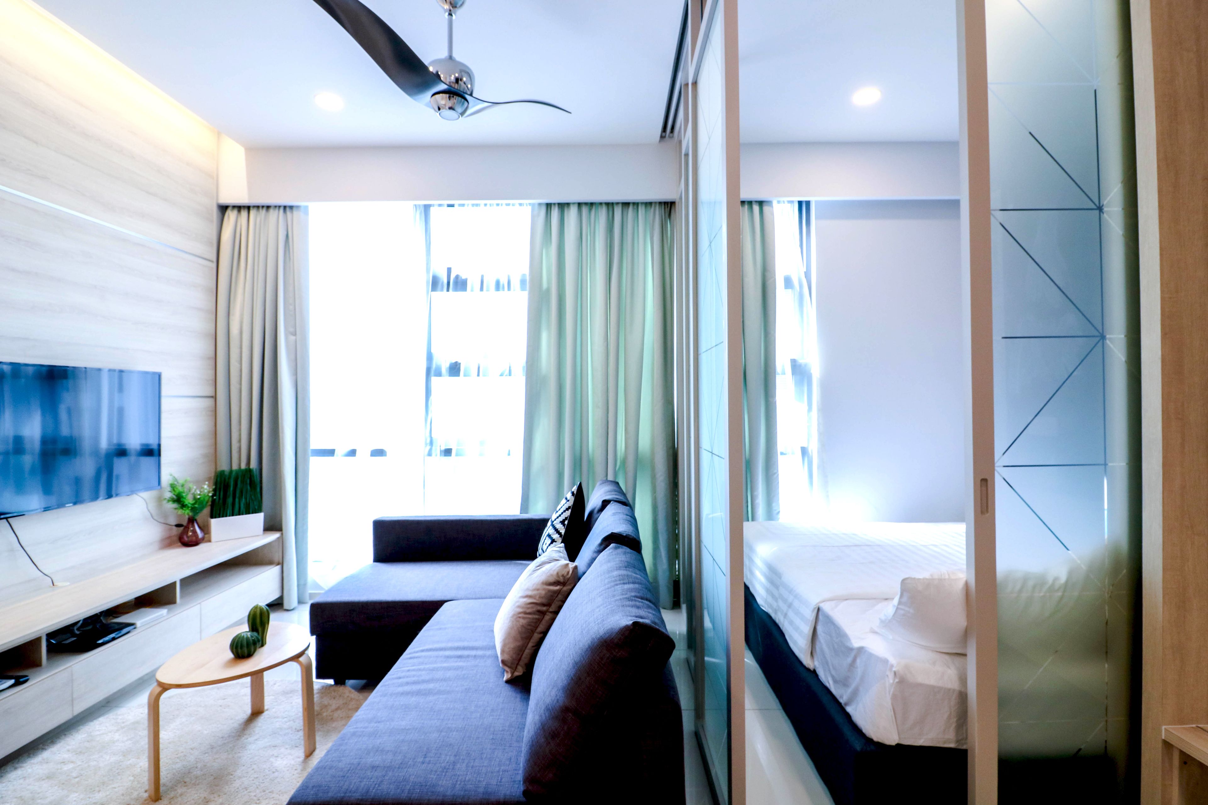 Deluxe Suite, 2 Bedrooms | Desk, laptop workspace, iron/ironing board, rollaway beds