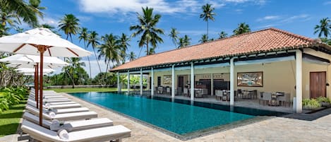 Outdoor pool, pool umbrellas, pool loungers