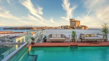 Outdoor pool, open 10:00 AM to 8:00 PM, pool loungers