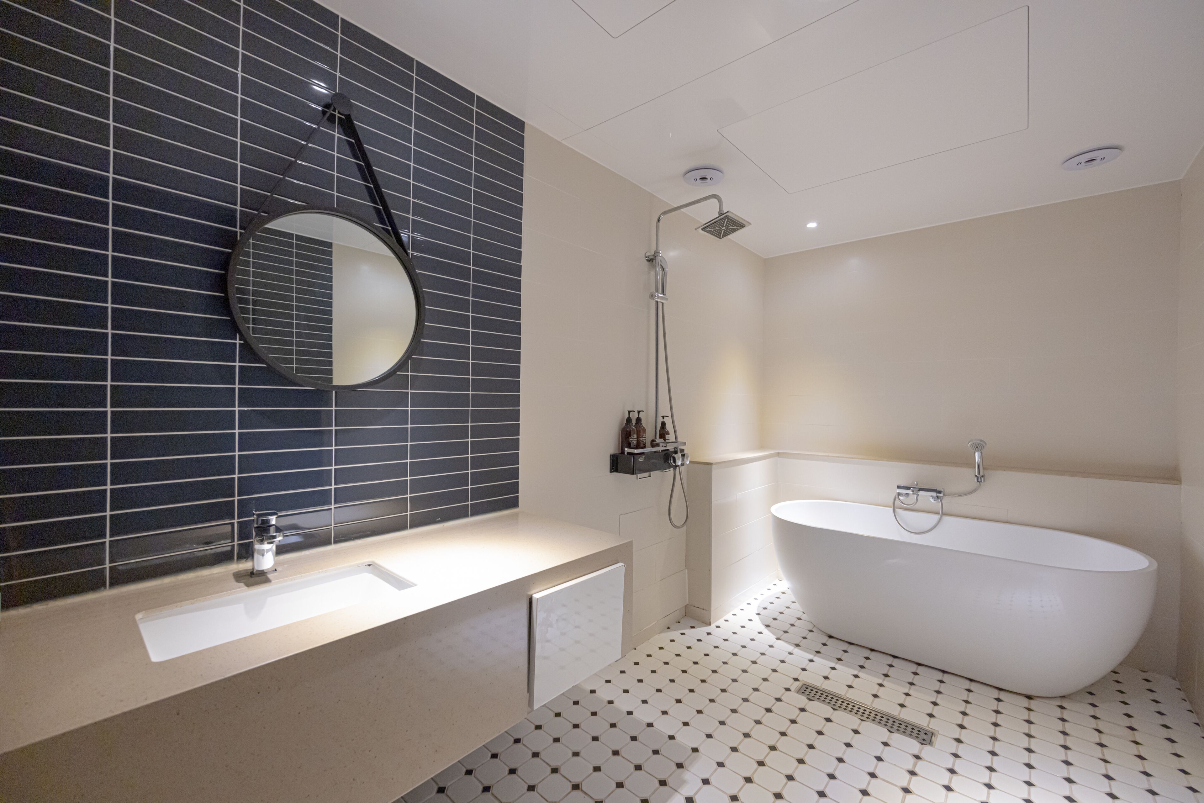 premier suite | bathroom | separate bathtub and shower, deep-soaking bathtub, designer toiletries