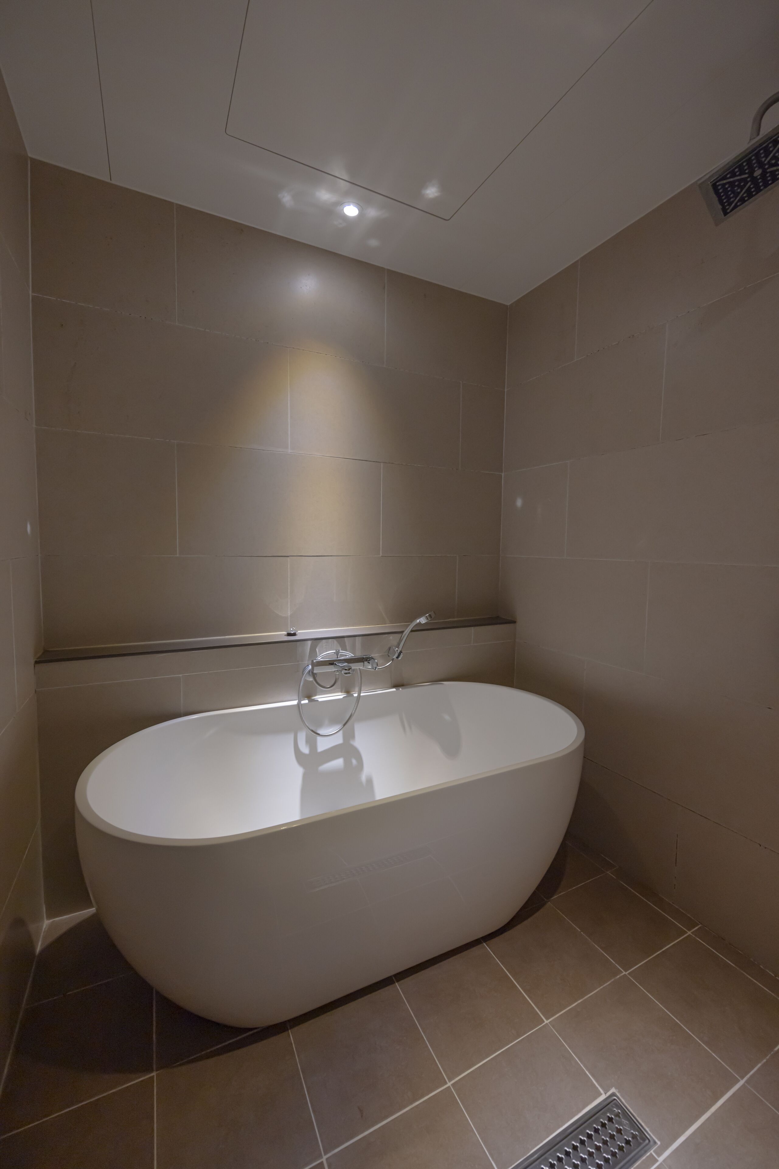 premier twin room | bathroom | separate bathtub and shower, deep-soaking bathtub, designer toiletries