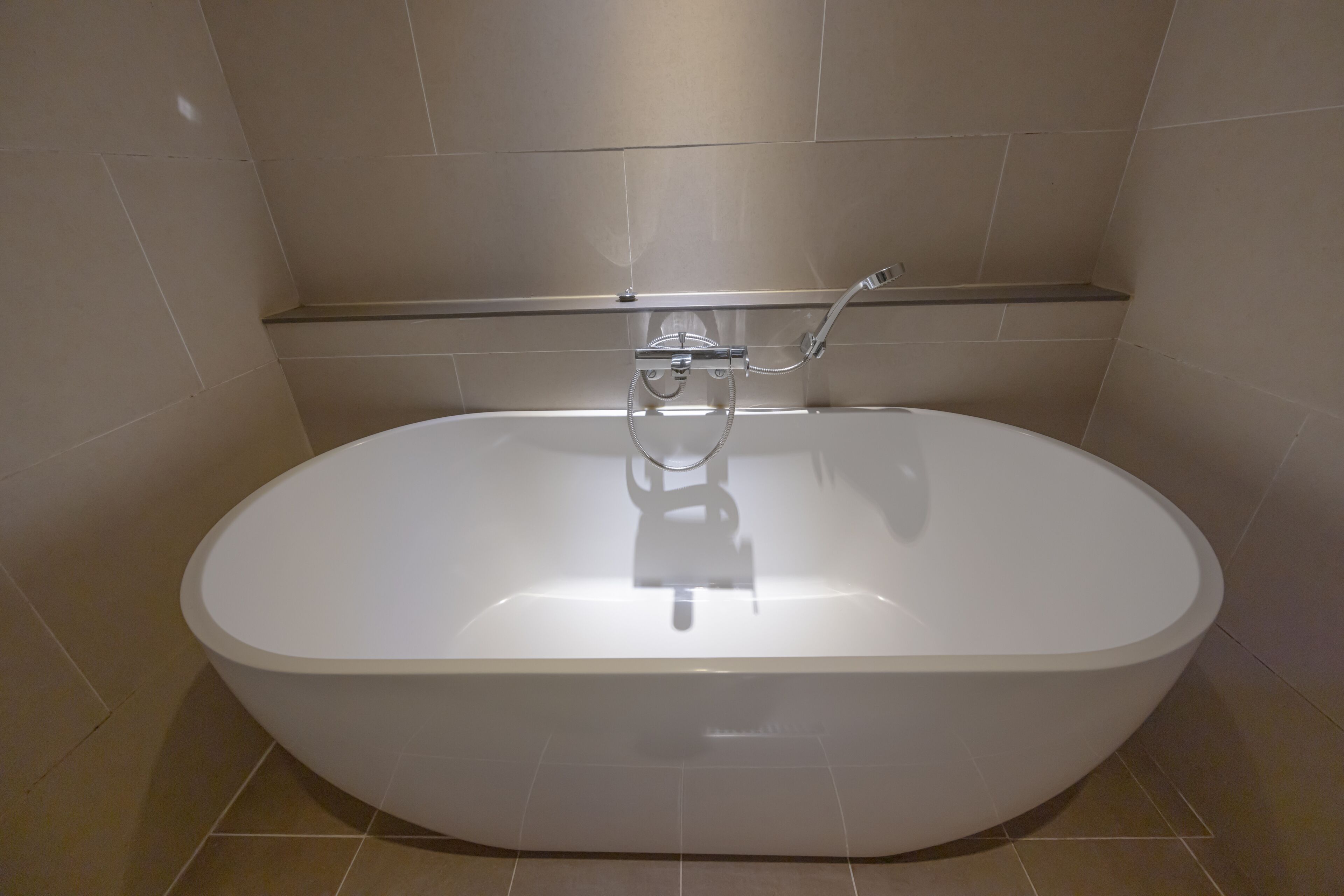 premier twin room | bathroom | separate bathtub and shower, deep-soaking bathtub, designer toiletries