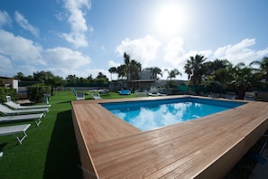 Seasonal outdoor pool, pool loungers