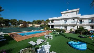 Seasonal outdoor pool, pool loungers