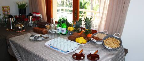 A breakfast buffet with various food items and beverages.