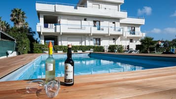Seasonal outdoor pool, pool loungers