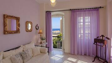 Apartment, 1 Bedroom, Sea View | Living room | Flat-screen TV