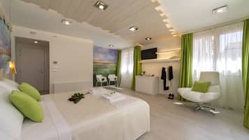 Suite | Down comforters, minibar, in-room safe, individually decorated