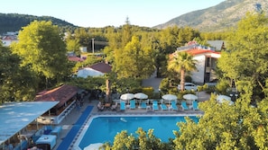 Outdoor pool, pool umbrellas, sun loungers