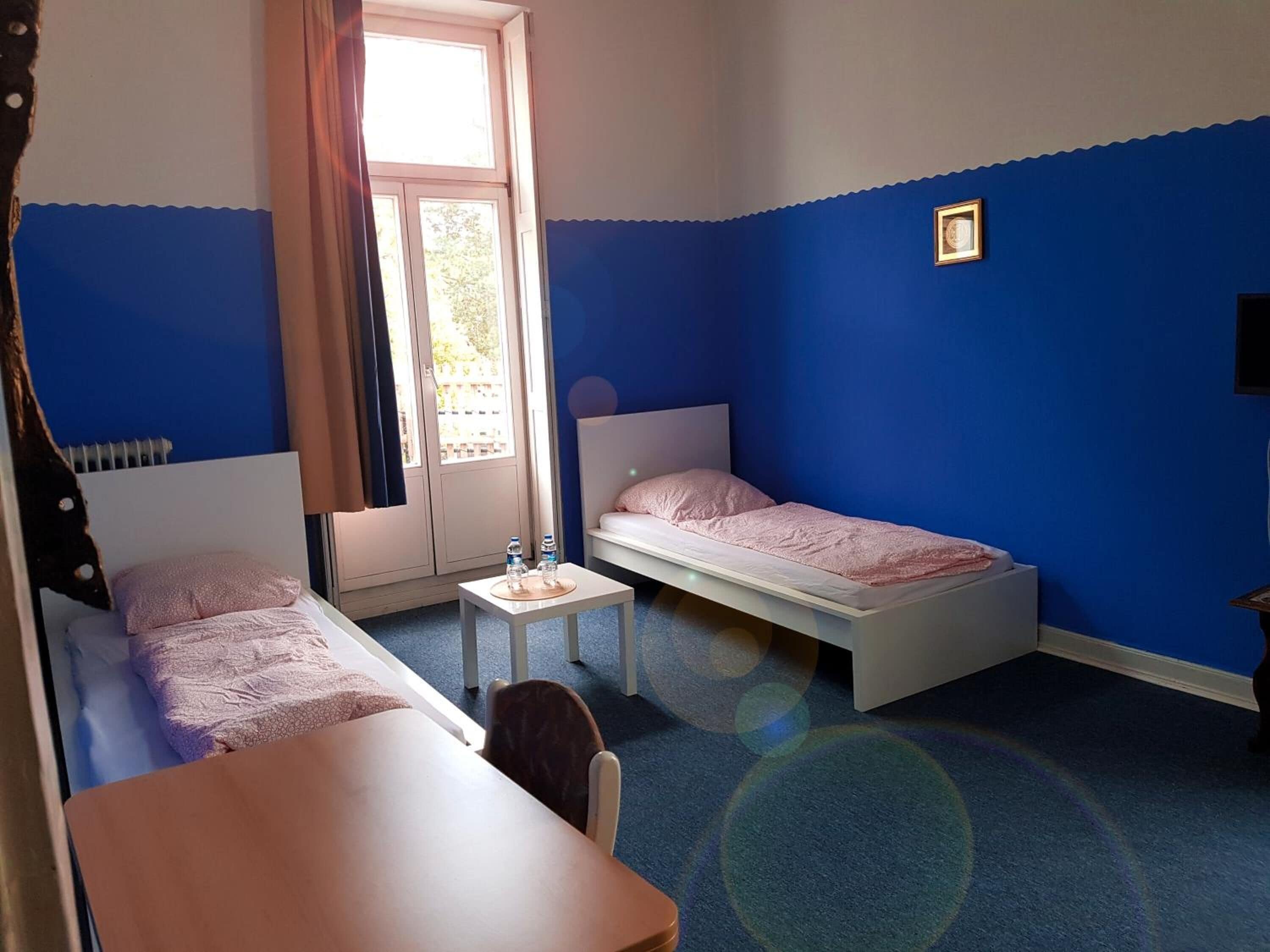 Desk, soundproofing, iron/ironing board, free cribs/infant beds