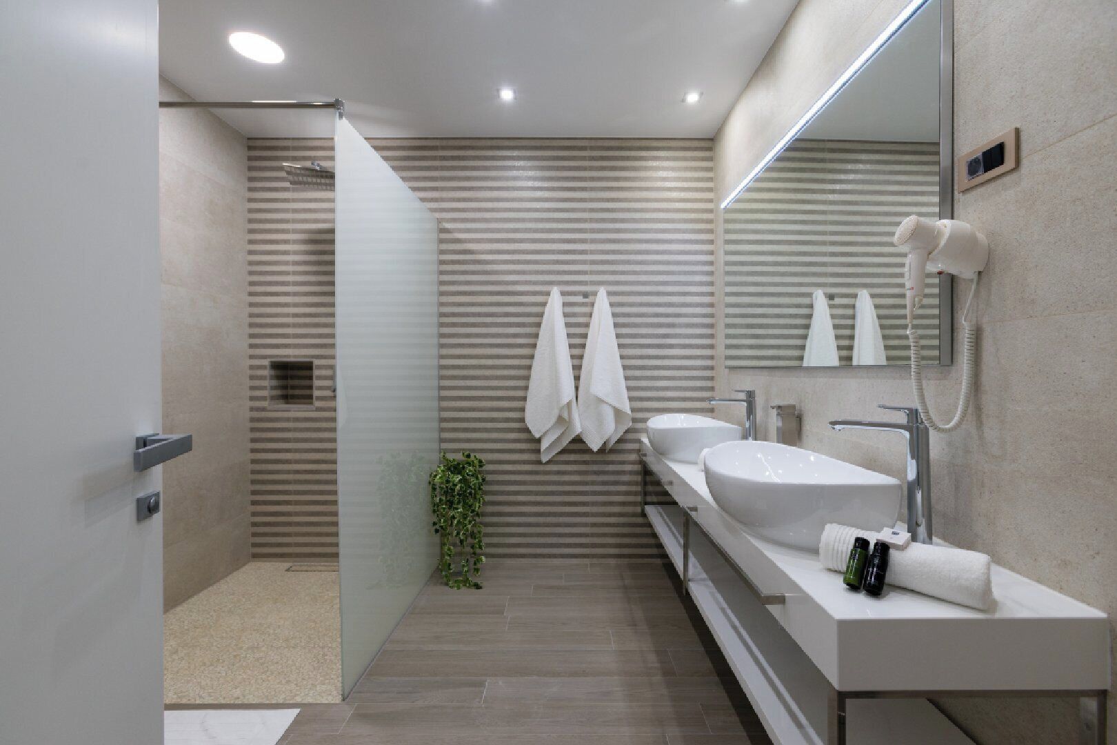 comfort double or twin room | bathroom | rainfall showerhead, eco-friendly toiletries, hair dryer, towels