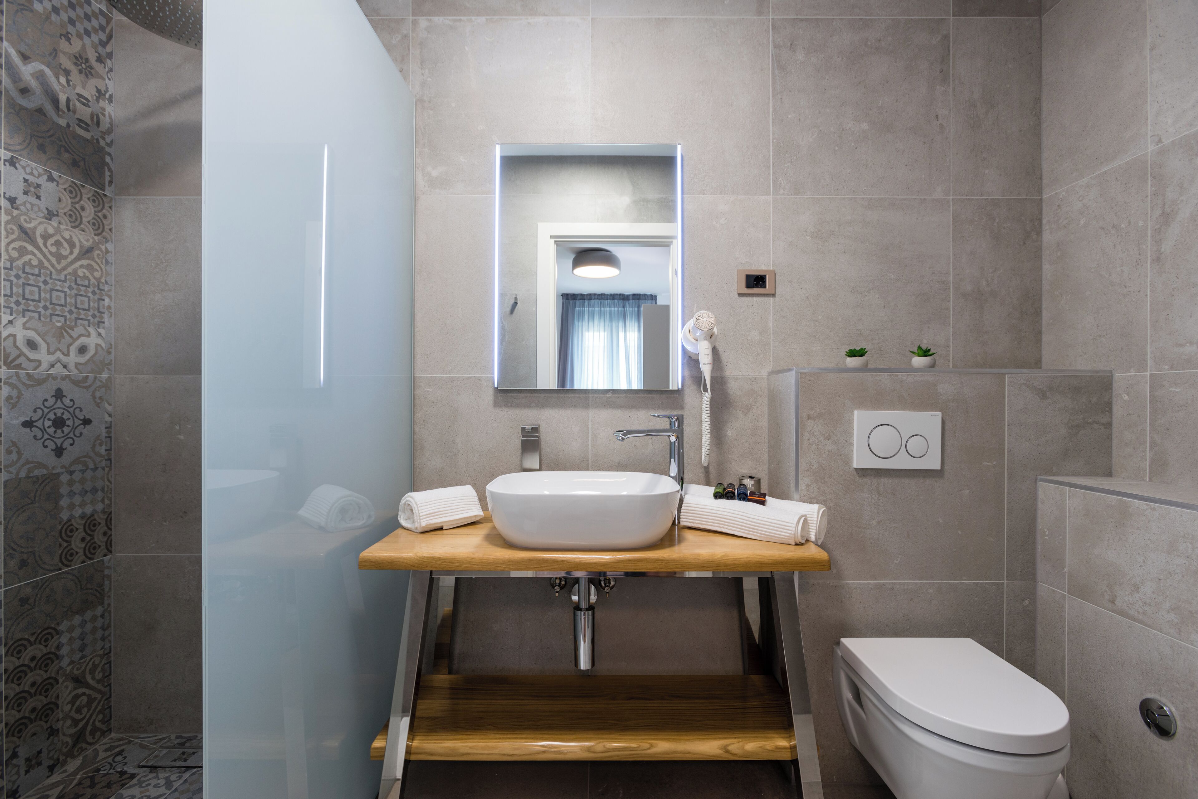 comfort double or twin room | bathroom | rainfall showerhead, eco-friendly toiletries, hair dryer, towels