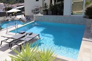 2 outdoor pools, open 9 AM to 9 PM, sun loungers