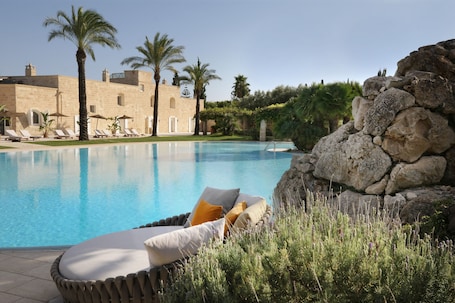 Seasonal outdoor pool, open 9:00 AM to 7:00 PM, pool umbrellas. Masseria Antonio Augusto