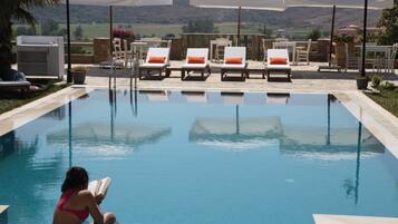 Outdoor pool, pool umbrellas, pool loungers
