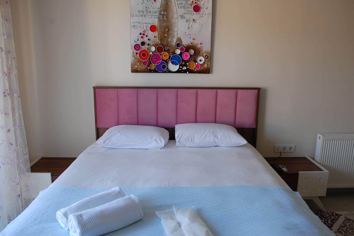 Premium bedding, desk, laptop workspace, iron/ironing board