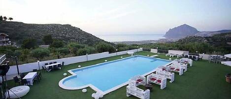 Seasonal outdoor pool, open 8:00 AM to 8:00 PM, pool umbrellas