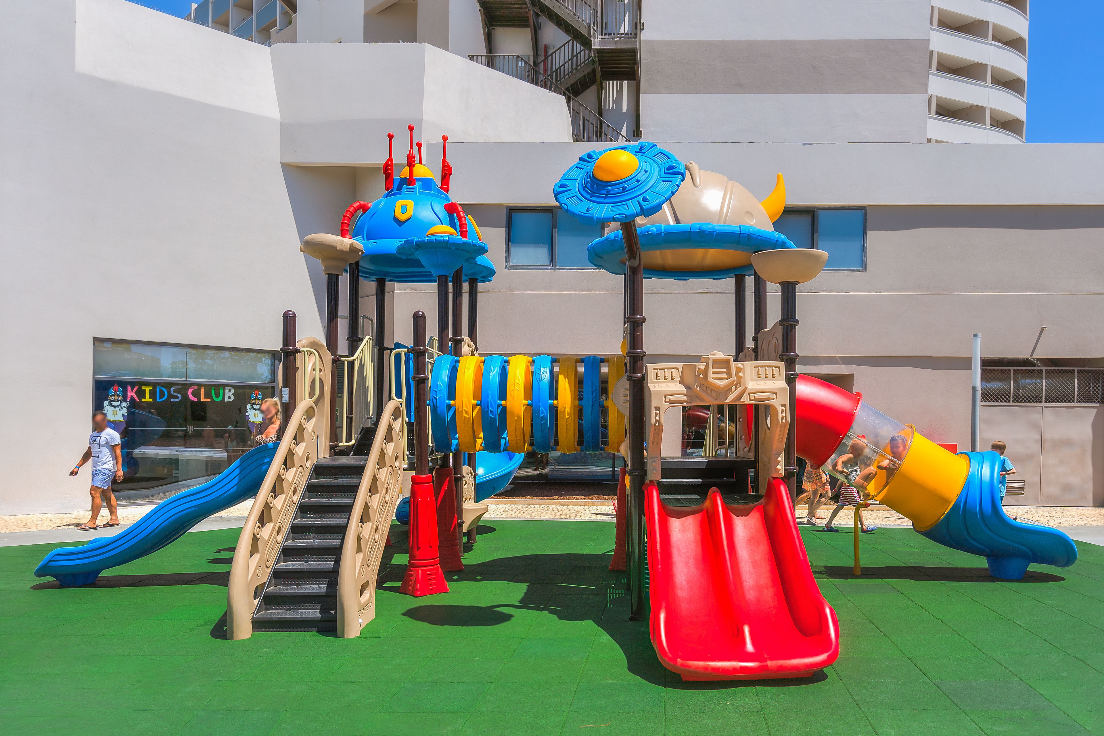 A playground with slides and climbing structures.