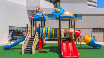 A playground with slides and climbing structures.
