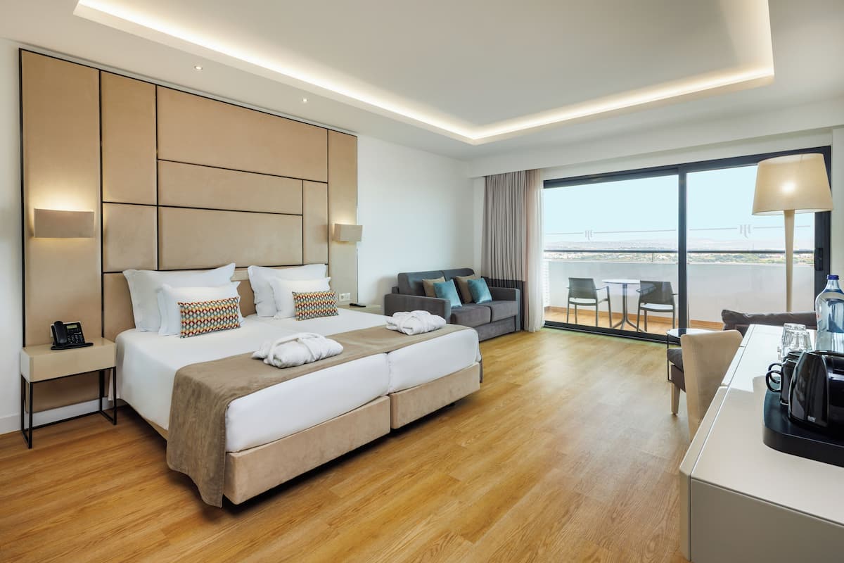 Family Suite, 1 Bedroom | Minibar, in-room safe, desk, laptop workspace