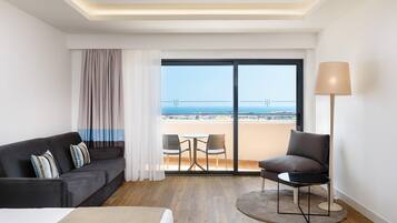 Deluxe Double Room, Sea View | Living area | 43-inch flat-screen TV with cable channels, TV, toys