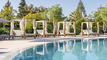 Indoor pool, 3 outdoor pools, open 10:00 AM to 7:00 PM, pool umbrellas