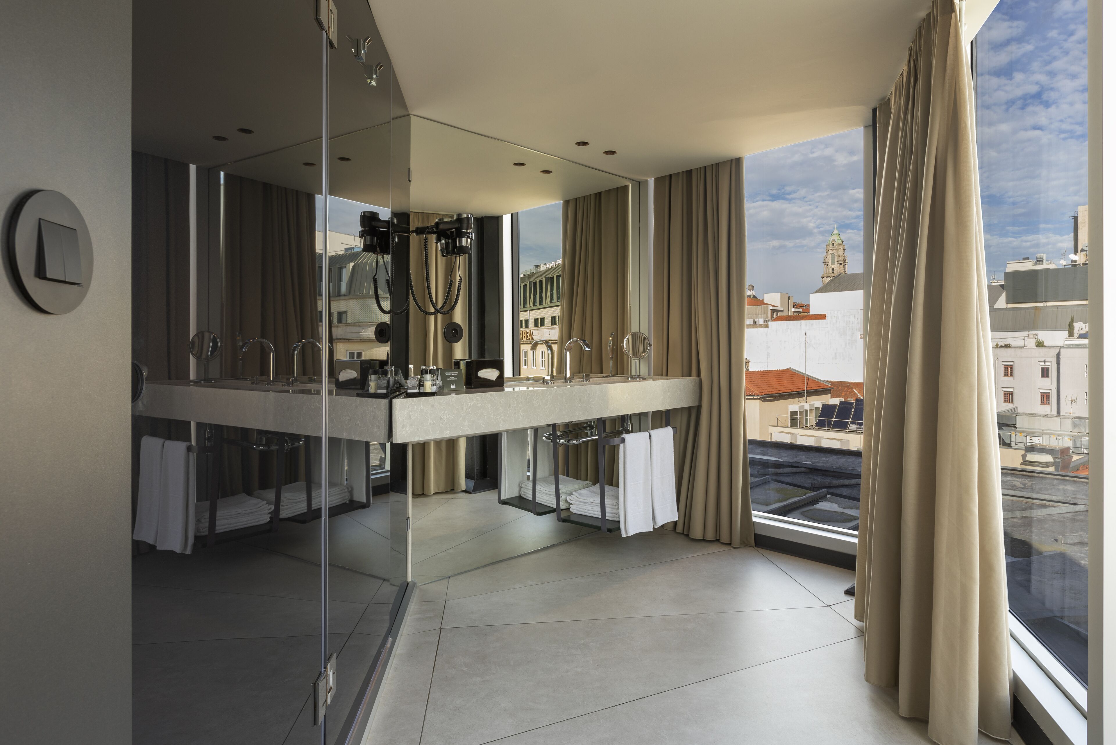 deluxe room | bathroom | shower, rainfall showerhead, free toiletries, towels