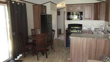 Cottage, 2 Bedrooms (No Linens Included) | Living area | Flat-screen TV, fireplace, DVD player