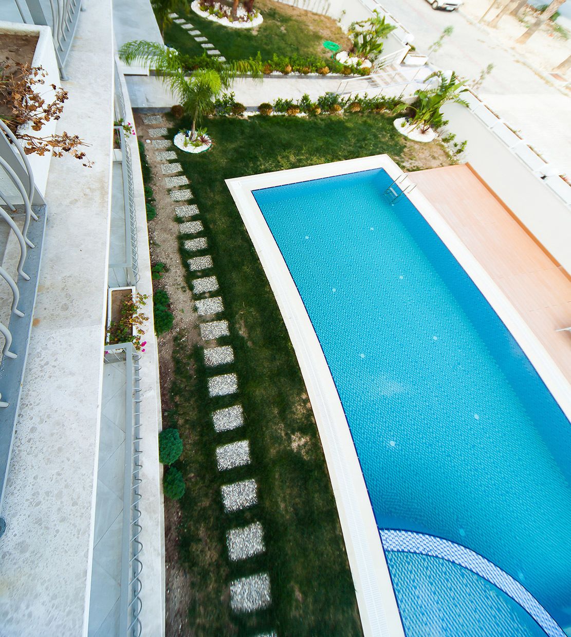 seasonal outdoor pool, pool umbrellas, pool loungers