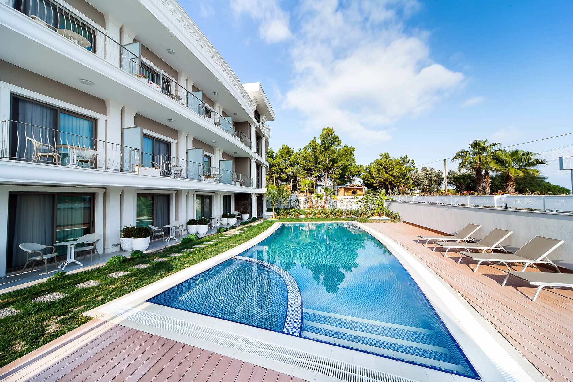 seasonal outdoor pool, pool umbrellas, pool loungers