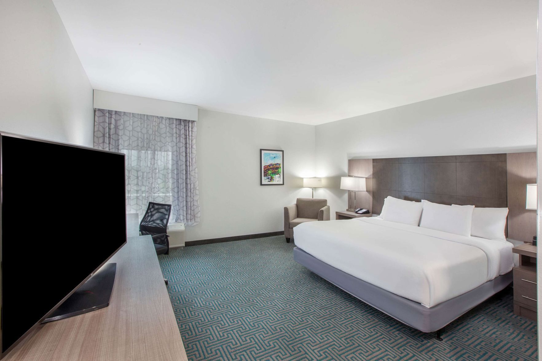 Premium bedding, desk, laptop workspace, soundproofing