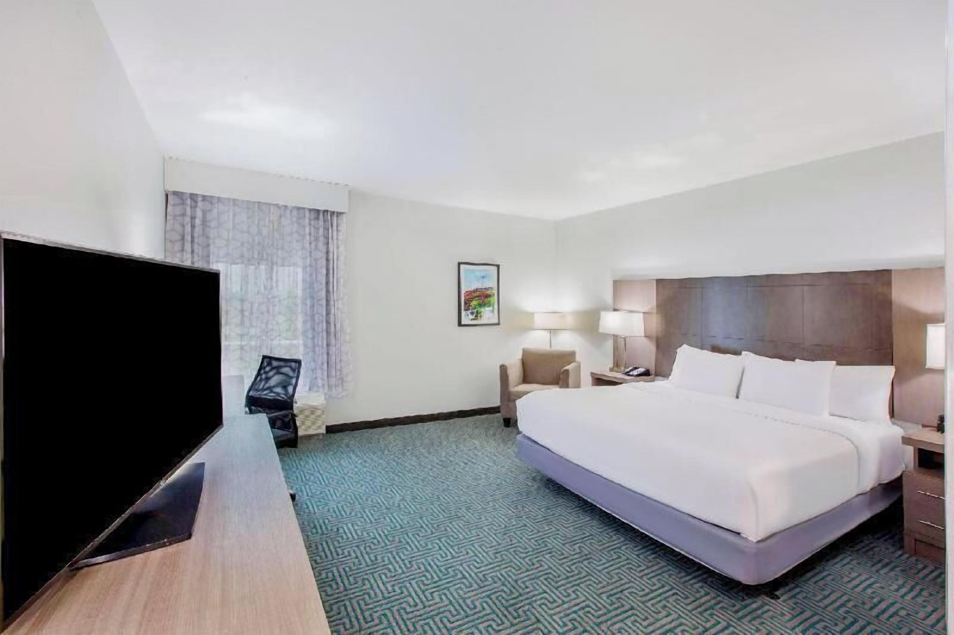 Premium bedding, desk, laptop workspace, soundproofing