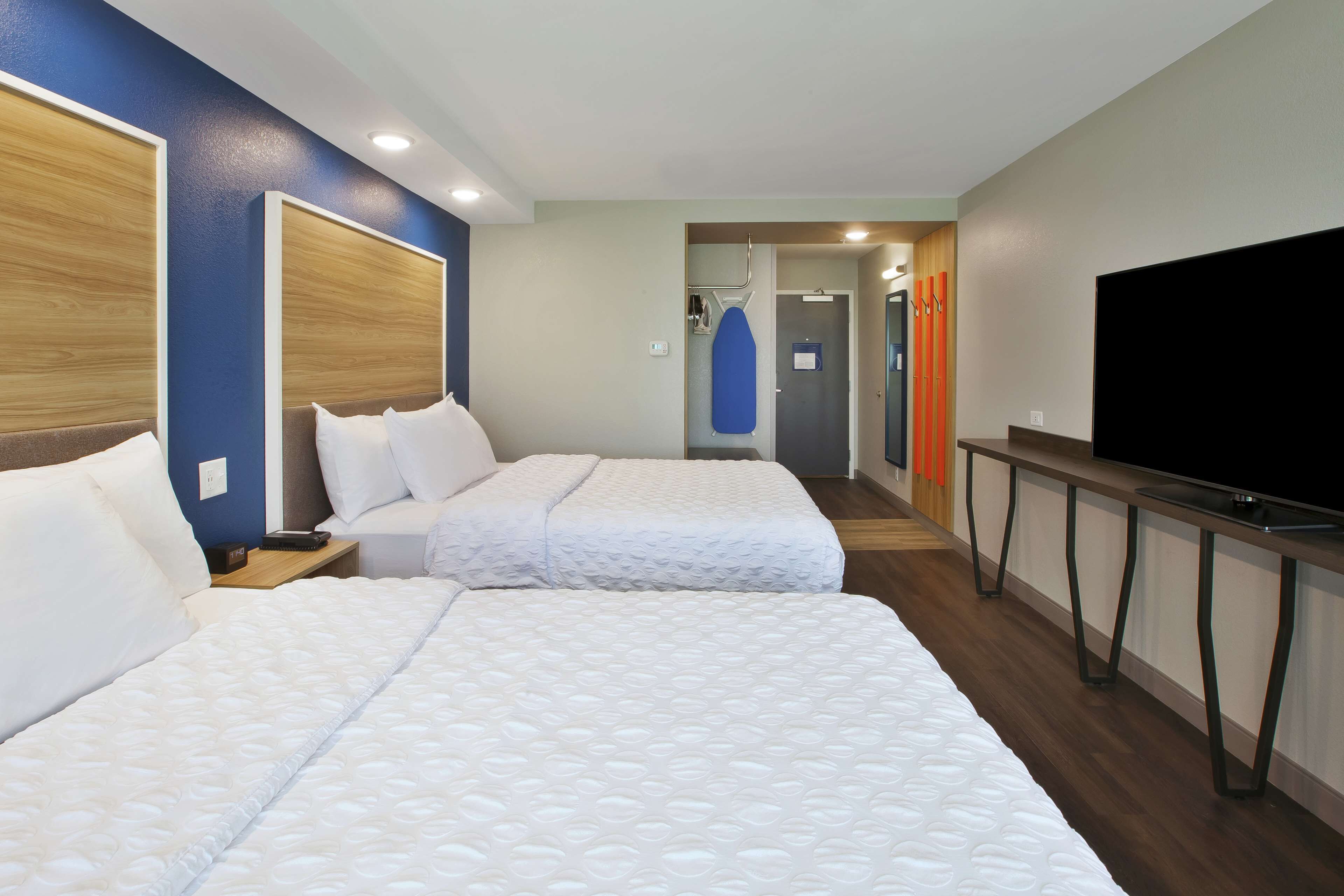 room, 2 queen beds | desk, laptop workspace, iron/ironing board, free cots/infant beds