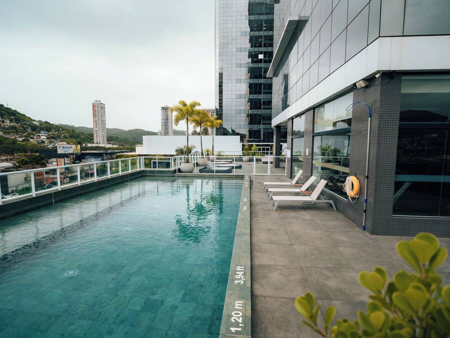 Outdoor pool, open 10:00 AM to 10:00 PM, pool loungers