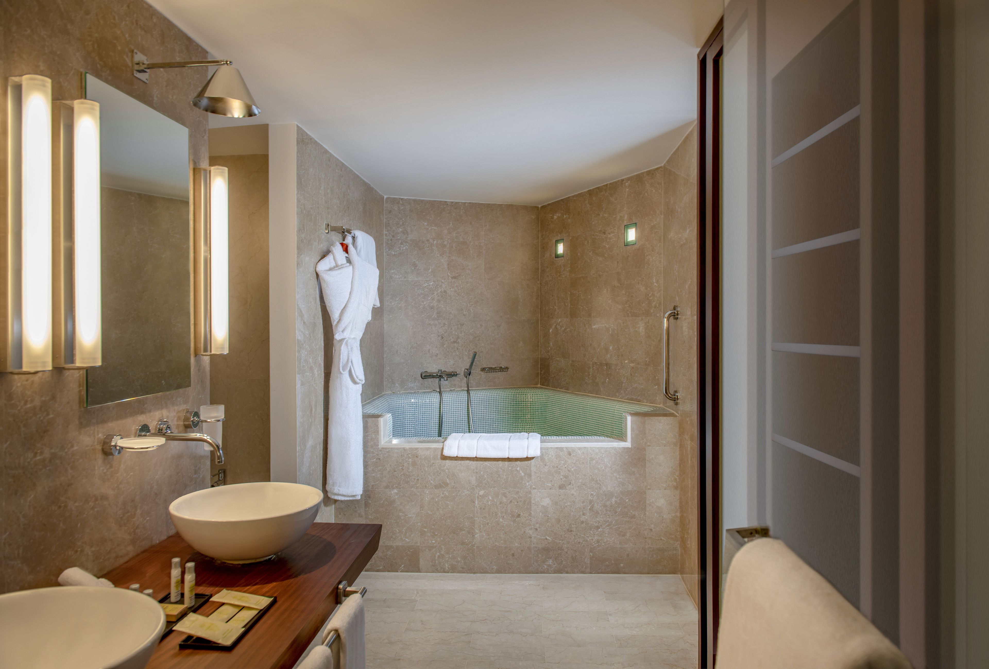 rainfall showerhead, designer toiletries, hair dryer, bathrobes