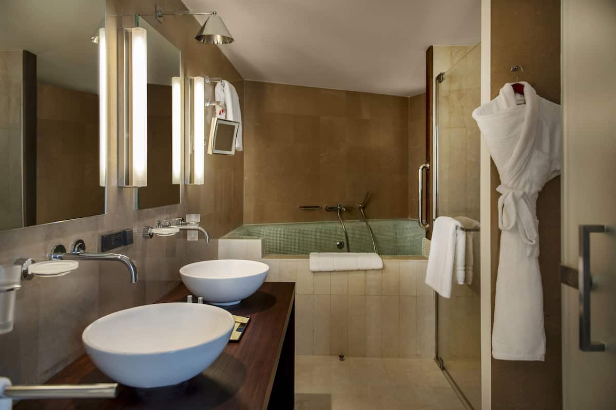 rainfall showerhead, designer toiletries, hair dryer, bathrobes