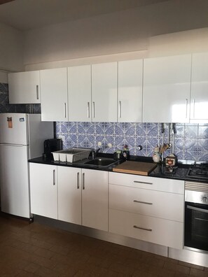 Fridge, microwave, oven, stovetop - Beachfront 1 bedroom holiday apartment in Quarteira, Algarve (Quarteira)