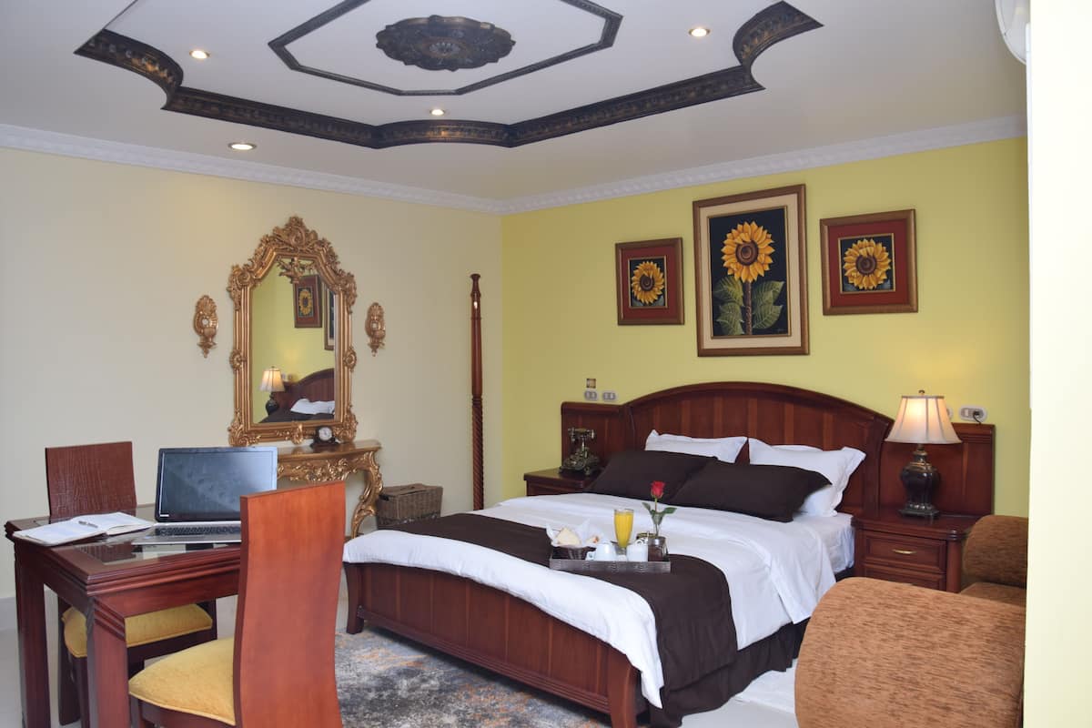 Deluxe Suite, 1 Queen Bed, Private Bathroom | 1 bedroom, minibar, desk, iron/ironing board