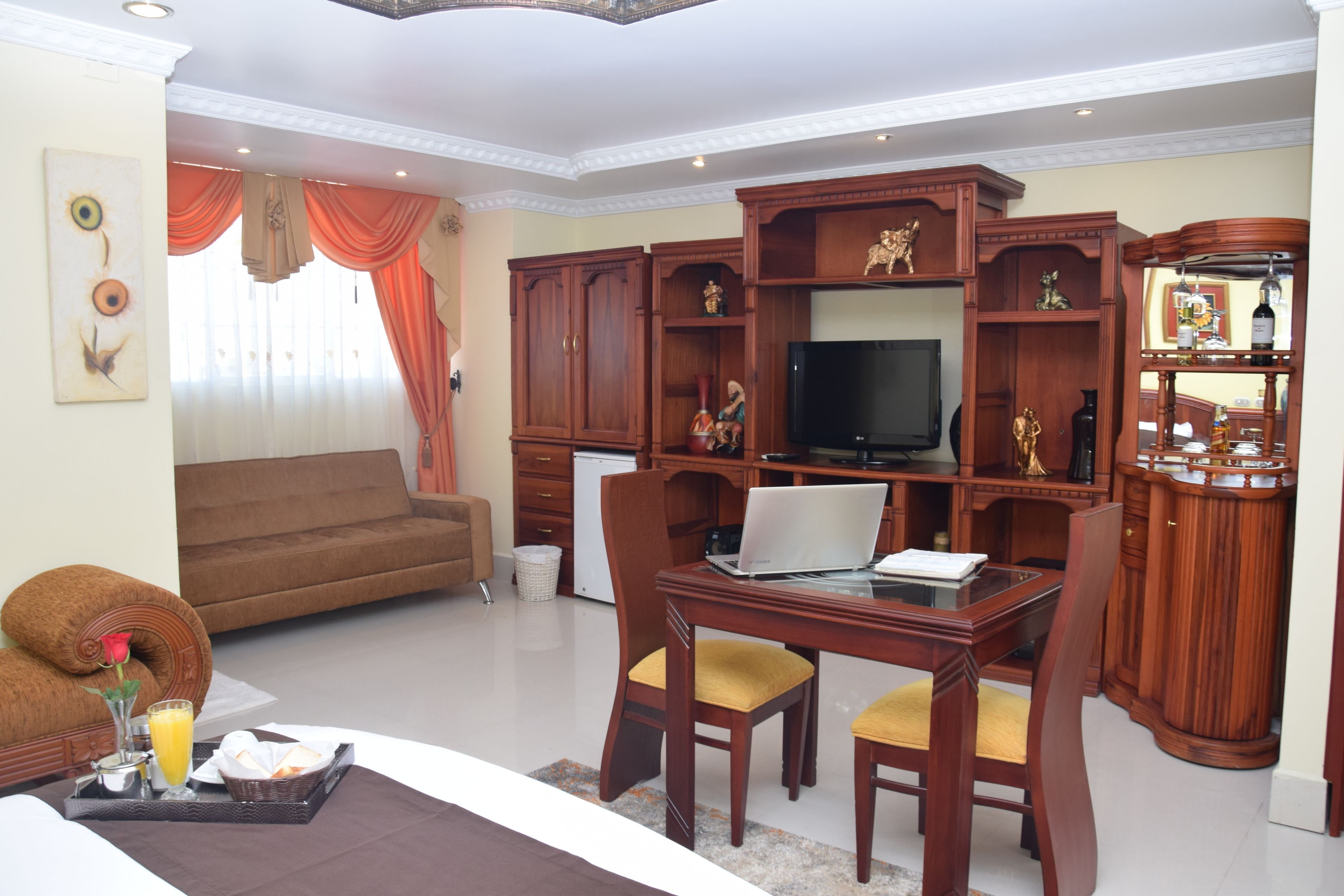 Deluxe Suite, 1 Queen Bed, Private Bathroom | 1 bedroom, minibar, desk, iron/ironing board