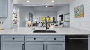 A kitchen with a sink, cabinets, and a dishwasher. - Cozy 3BR / 3.5 BA Retreat - Neighborhood Pool!  access included! (Johns Island)